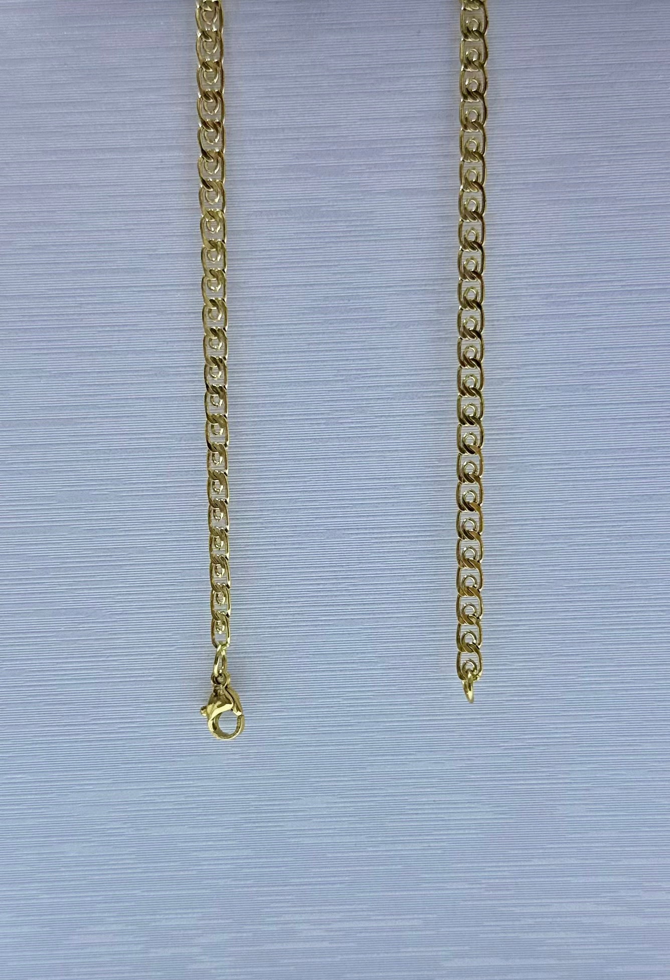 Collar en acero dorado de varón (60cm)
