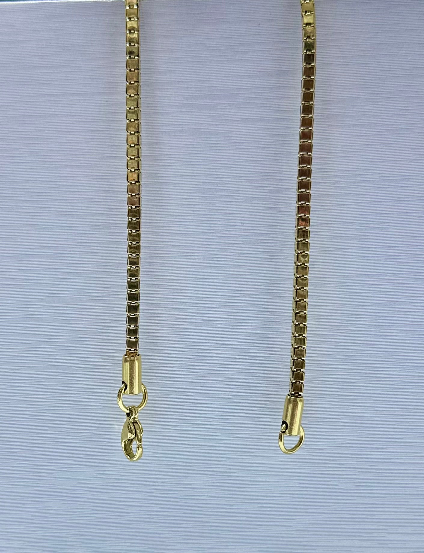 Collar en acero dorado de varón (60cm)