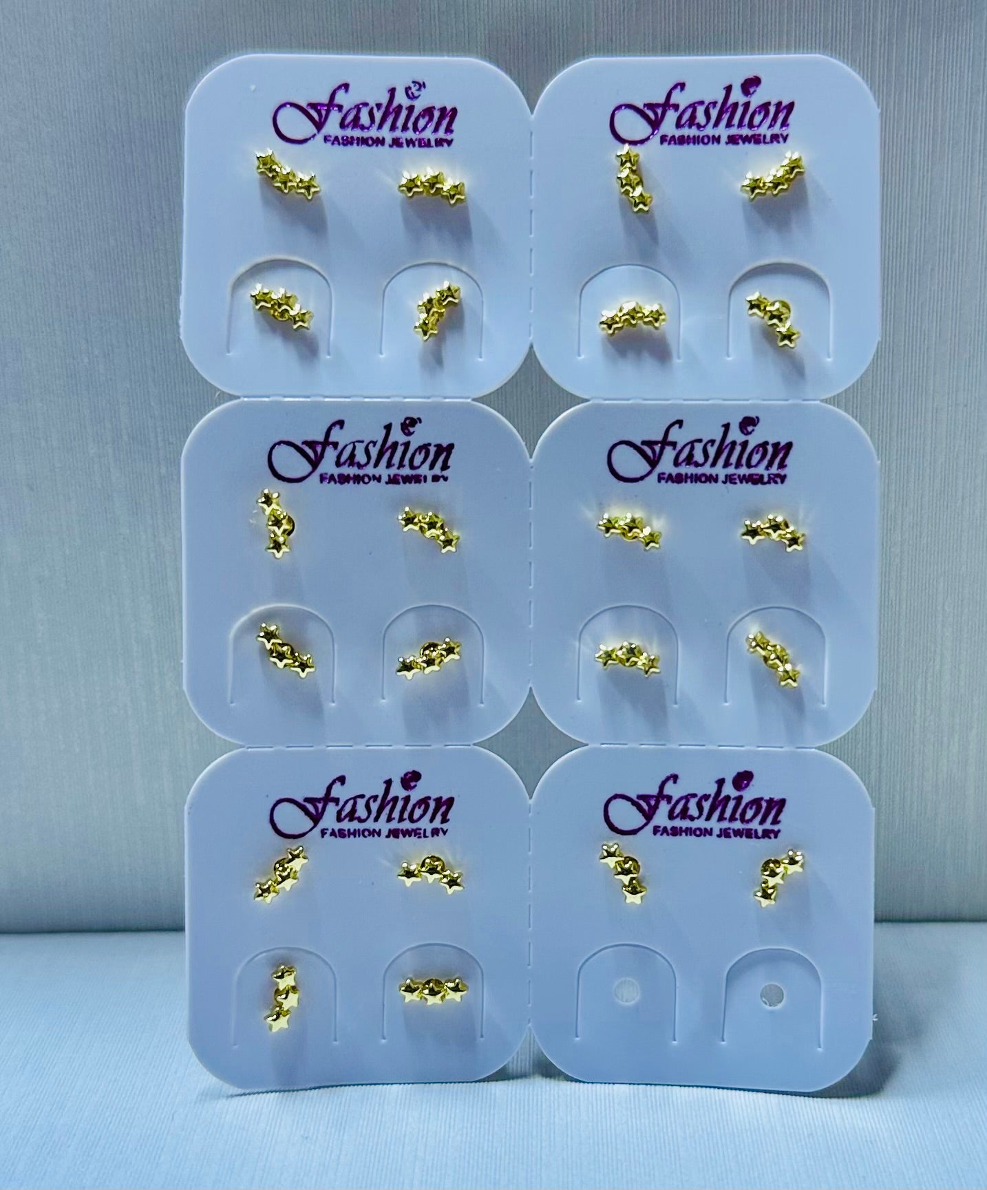 Arete miniatura estrella por 12 pares.