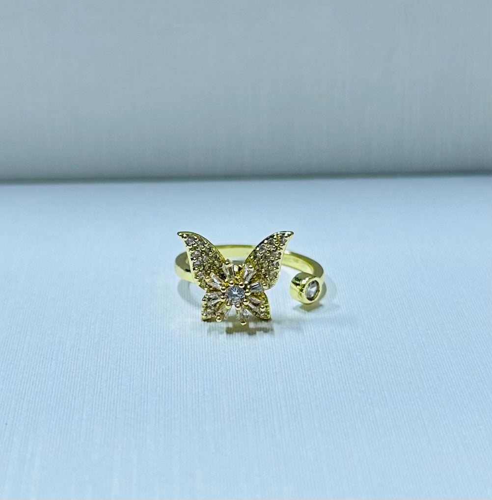 Anillo mariposa giratorio regulable