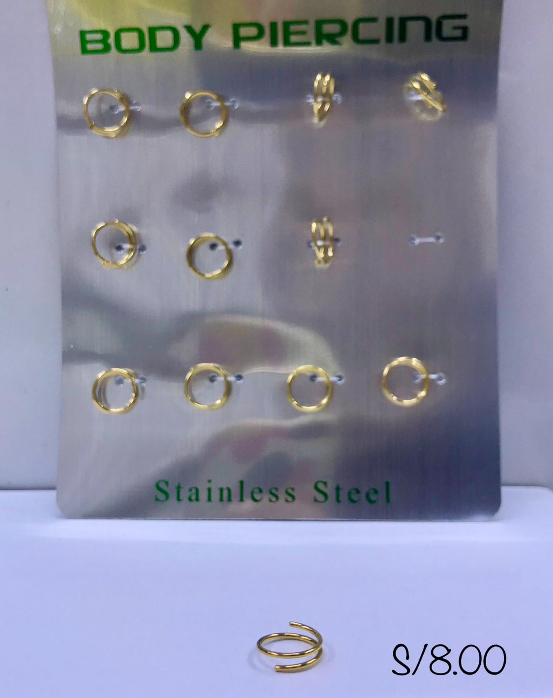 Piercing espiral dorado por blíster de 12 und.