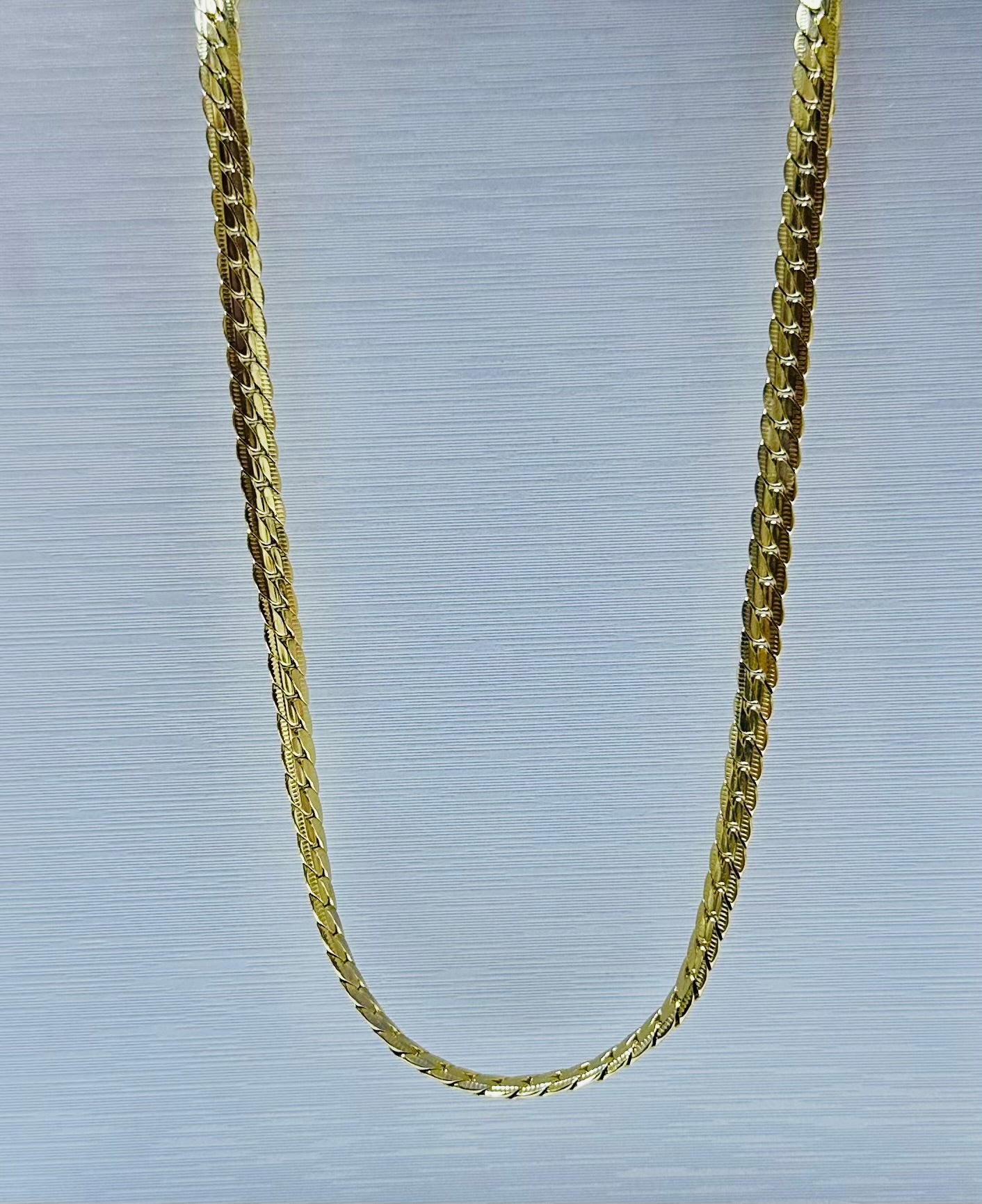 Collar en acero dorado de varón (60cm)