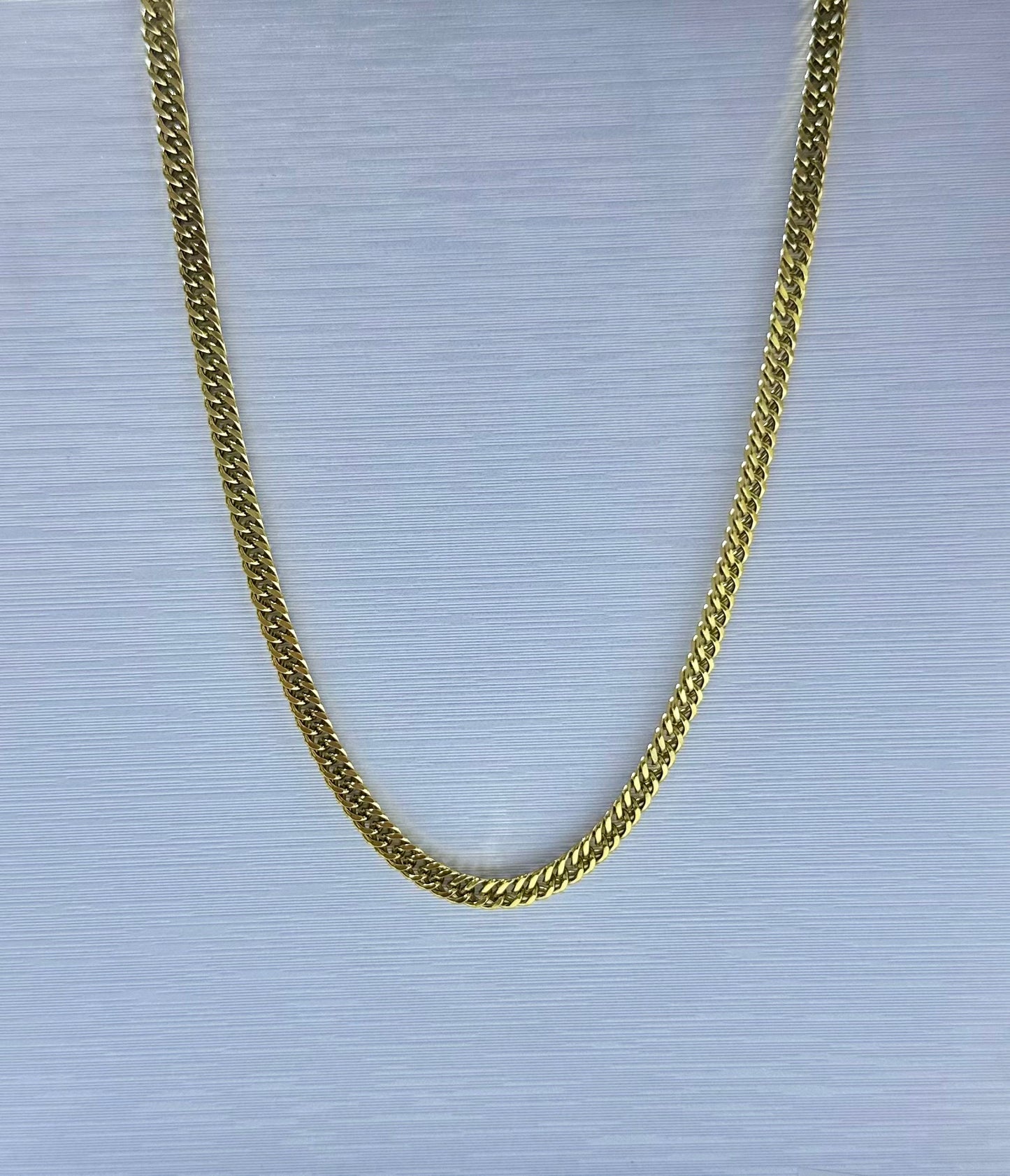 Collar lomo de corvina en acero dorado de varón #2 (60cm)