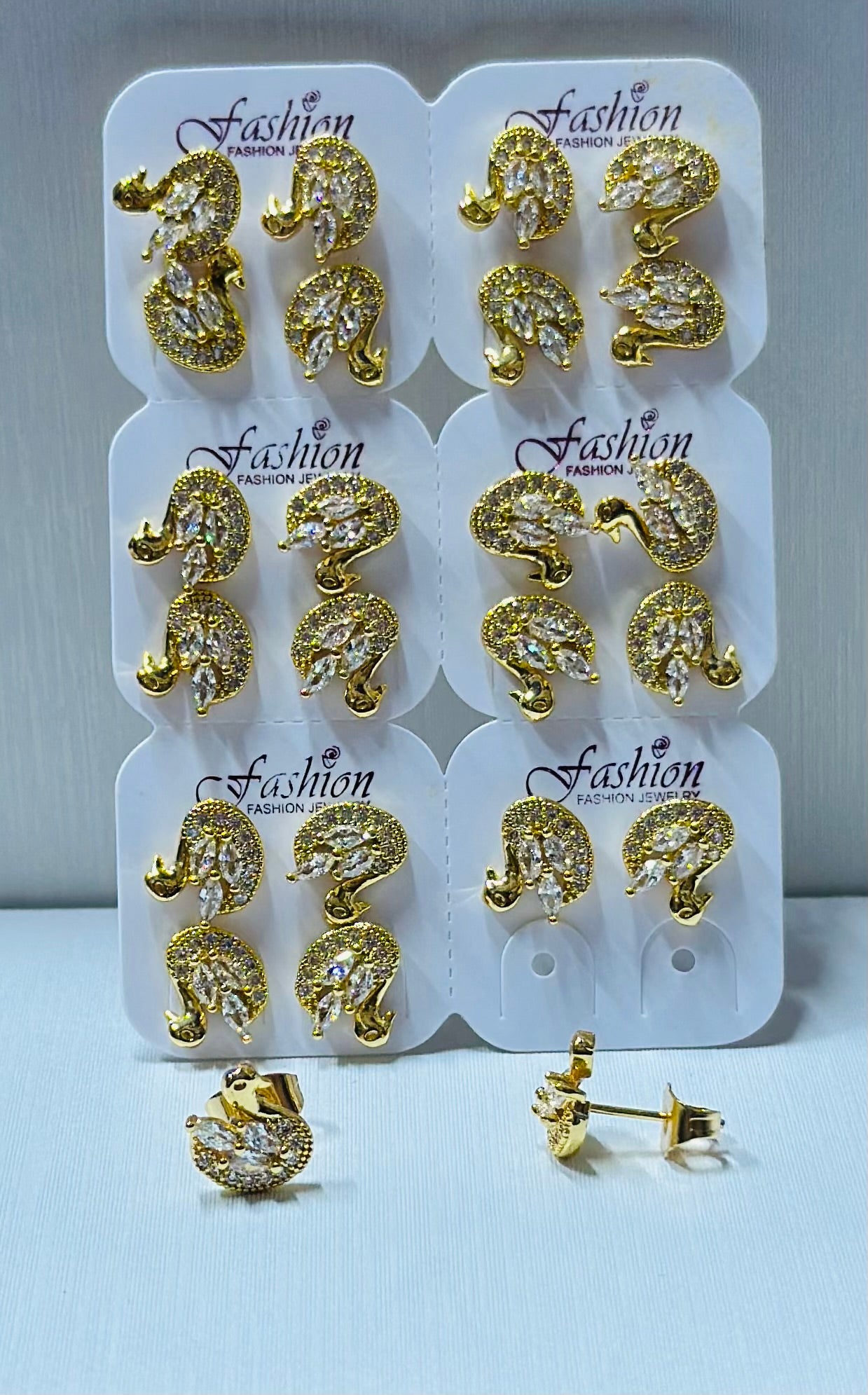 Arte cisne con piedras zircon por 12 pares.