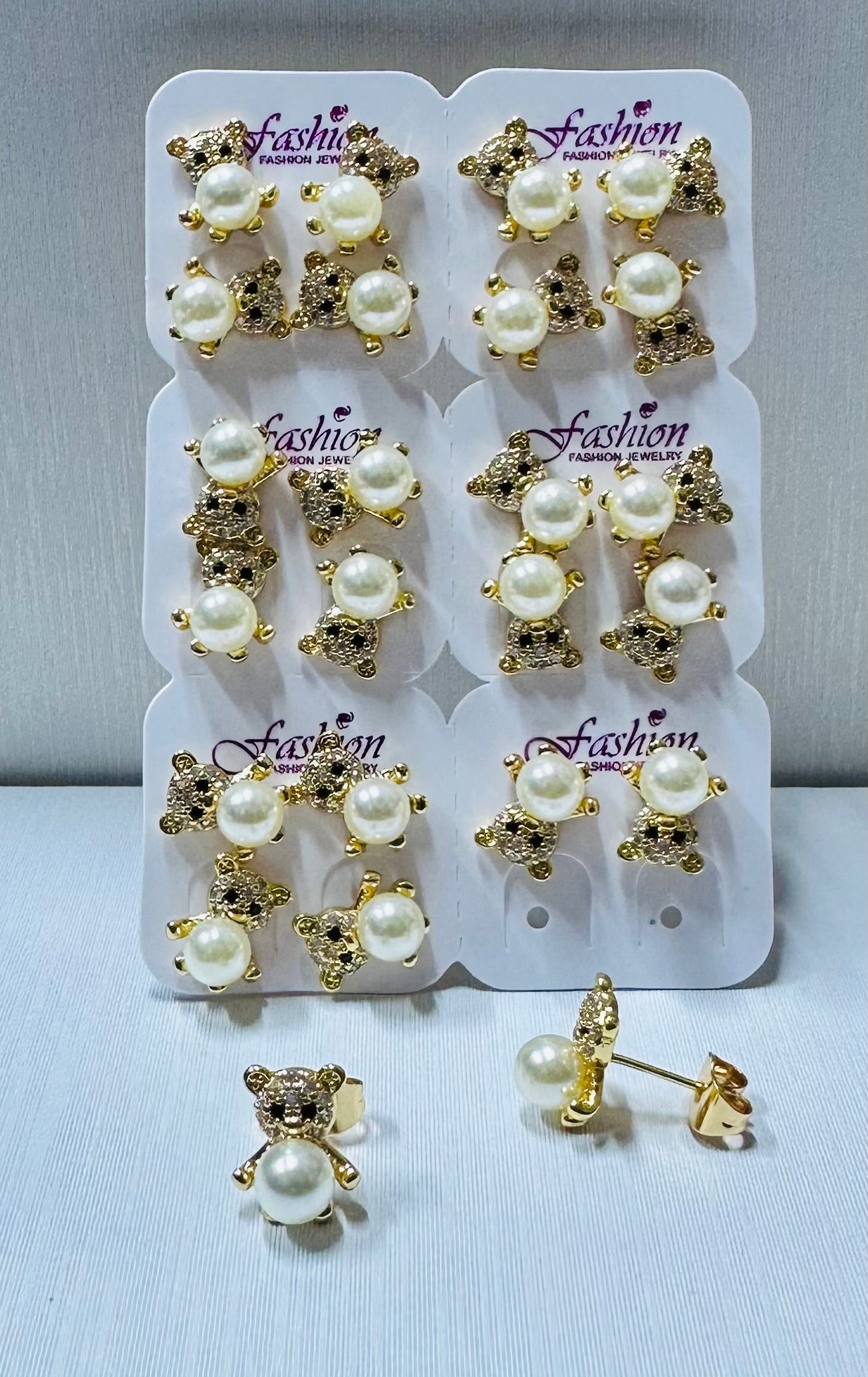 Arete oso con perla y piedras de zircon por 12 pares